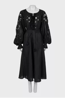 Linen dress decorated with perforation
