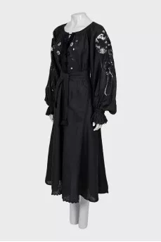 Linen dress decorated with perforation