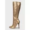 Gold colored snakeskin boots
