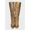 Gold colored snakeskin boots