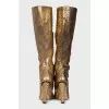 Gold colored snakeskin boots