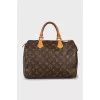 Speedy bag with branded hardware