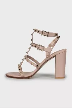 Leather sandals decorated with golden spikes