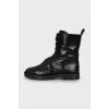 Leather boots decorated with a strap