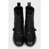 Leather boots decorated with a strap
