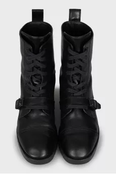 Leather boots decorated with a strap