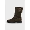 Suede boots decorated with straps
