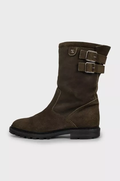 Suede boots decorated with straps