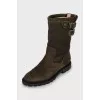 Suede boots decorated with straps