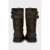 Suede boots decorated with straps