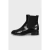 Black leather boots with textile inserts