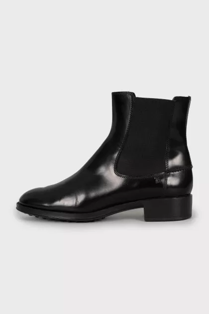Black leather boots with textile inserts