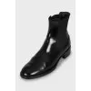 Black leather boots with textile inserts