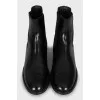 Black leather boots with textile inserts