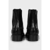 Black leather boots with textile inserts