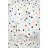 White dress in colored peas