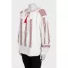 Blouse with wide sleeves decorated with embroidery