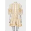 Beige dress decorated with lace