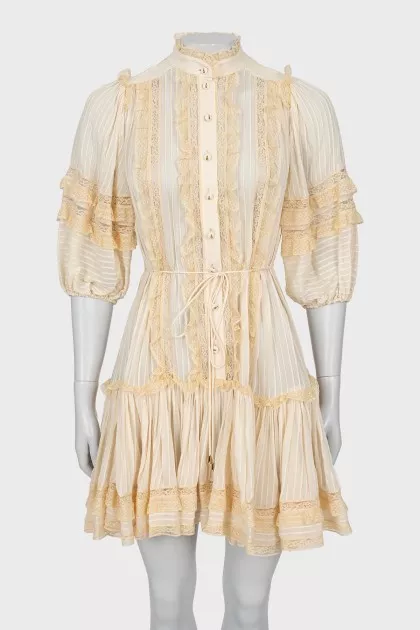 Beige dress decorated with lace