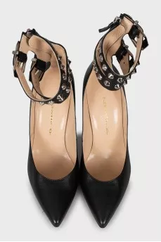 Leather shoes decorated with buckles and studs