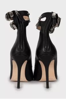 Leather shoes decorated with buckles and studs