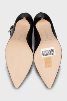Leather shoes decorated with buckles and studs