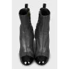 Ankle boots decorated with chain