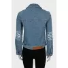 Denim jacket with decorated sleeves