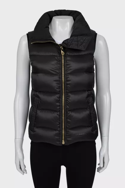 Black vest with gold fittings