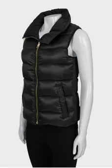 Black vest with gold fittings