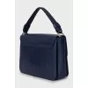 Leather bag with a flap in blue