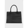 Leather bag with the brand's signature logo