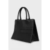 Leather bag with the brand's signature logo