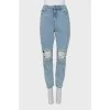 Ripped jeans decorated with crystals
