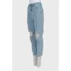 Ripped jeans decorated with crystals