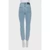 Ripped jeans decorated with crystals