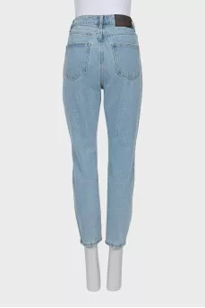 Ripped jeans decorated with crystals