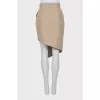 Skirt with pockets decorated with buttons