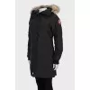 Down jacket decorated with natural fur