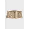 Belt made of leather and textile in gold color