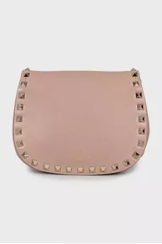 Leather bag decorated with spikes
