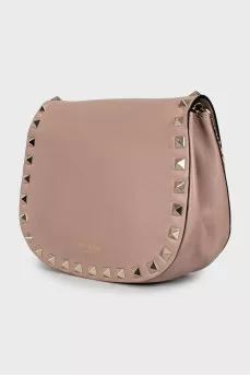 Leather bag decorated with spikes