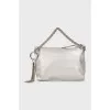 Leather bag decorated with tassel