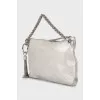 Leather bag decorated with tassel