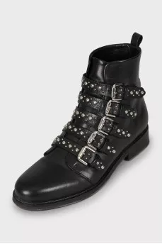 Black leather boots decorated with straps