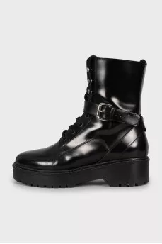 Leather boots decorated with straps