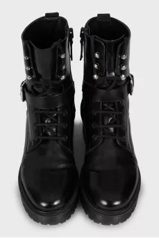 Leather boots decorated with straps