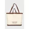 Bag with leather handles and signature print