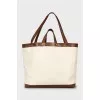 Bag with leather handles and signature print