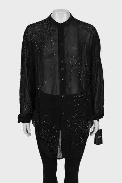 Black blouse decorated with rhinestones